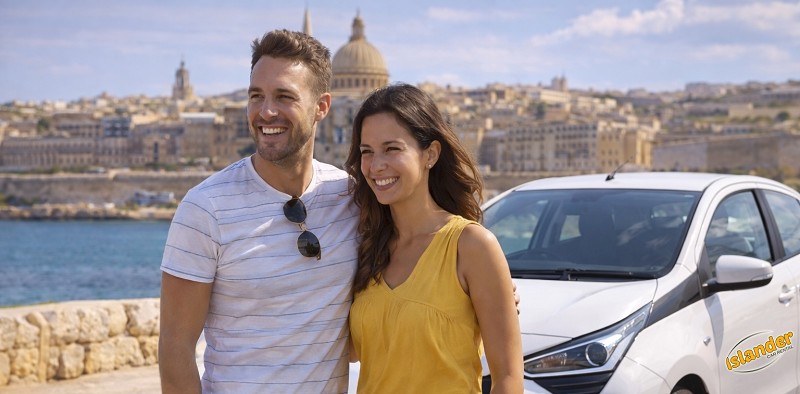 A couple beside an Islander car with Valletta across the harbour