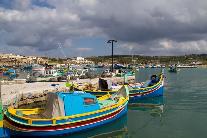 Painted luzzu fishing boats in Marsaxlokk harbour